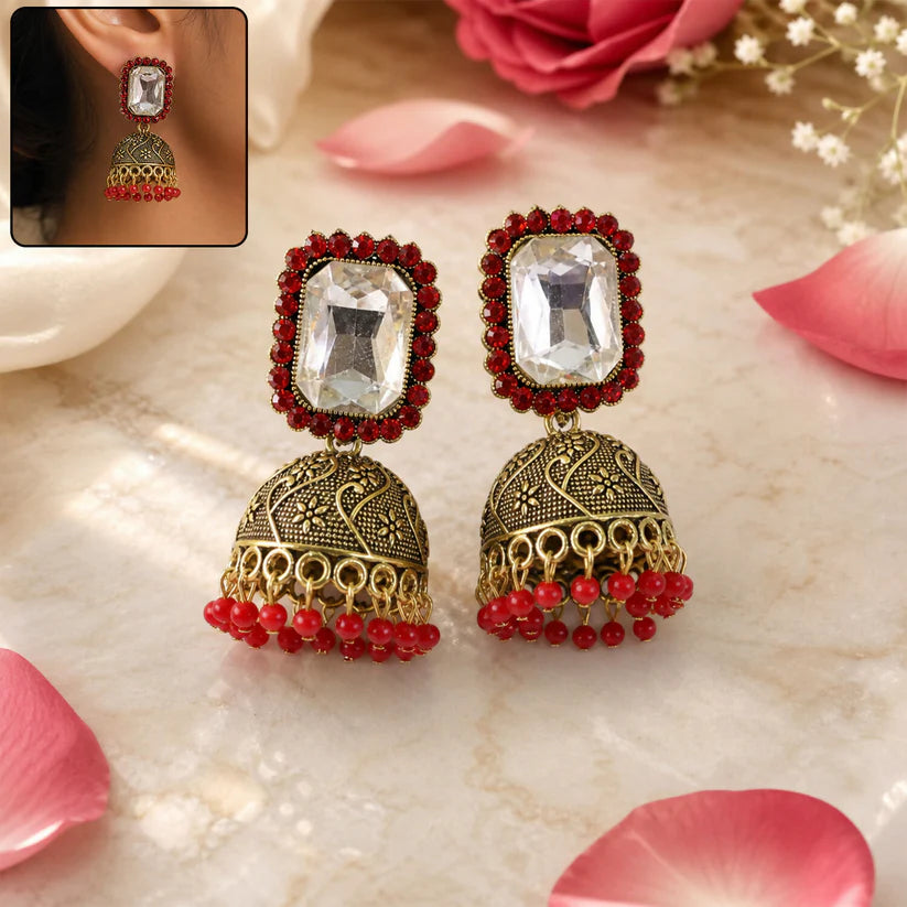 Red stone antique gold jhumka earrings with clear center stud design